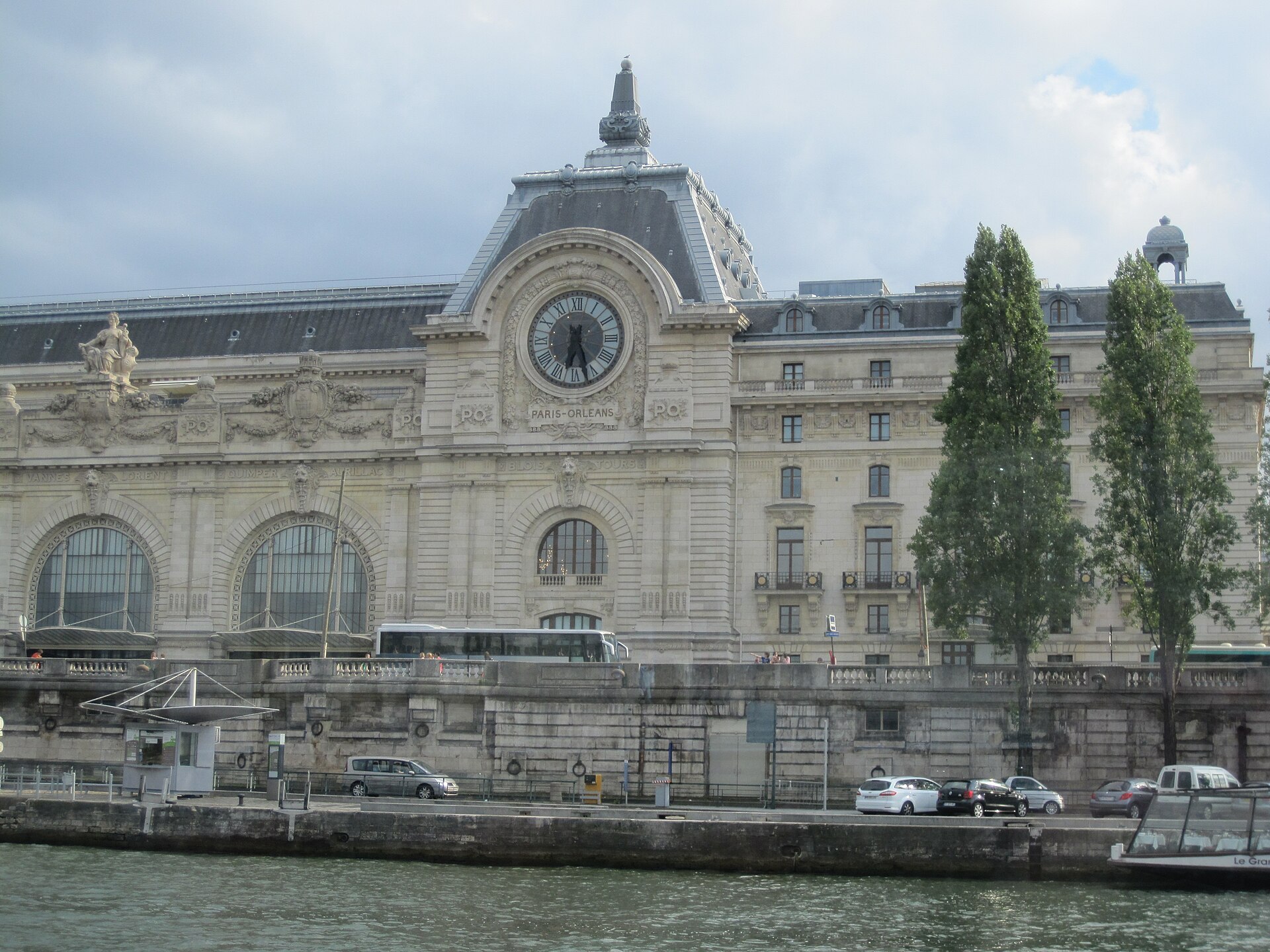 The Musee d'Orsay's Beaux-Arts facade and giant clock seen from the Seine